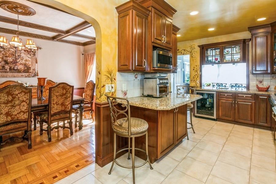 156 80th Street Brooklyn, NY 11209 - Photo 16 of 37 a kitchen with stainless steel appliances granite countertop a sink and cabinets