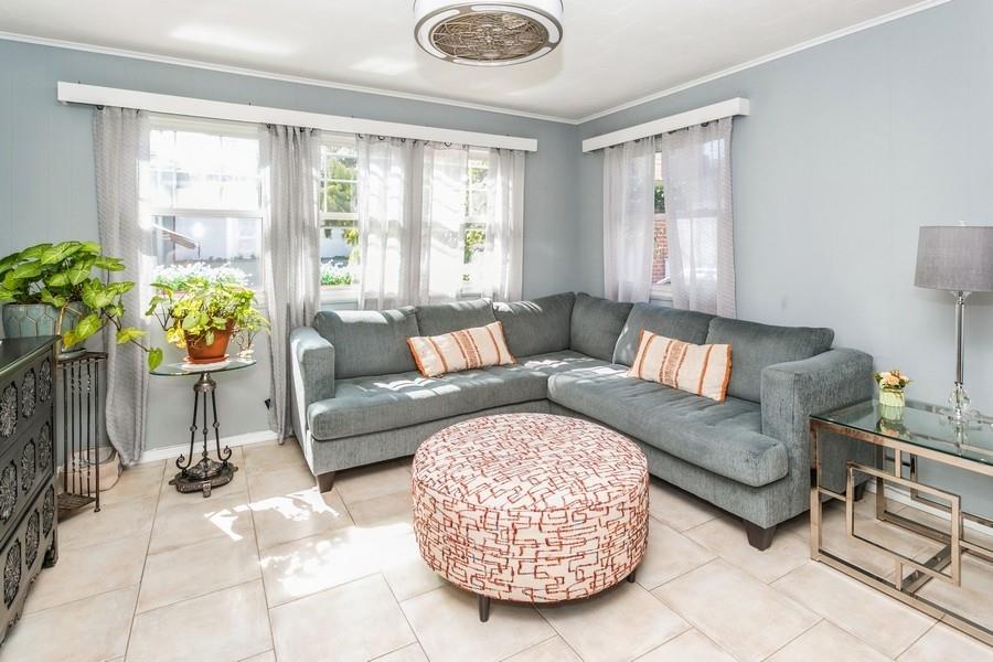 156 80th Street Brooklyn, NY 11209 - Photo 17 of 37 a living room with furniture and a large window