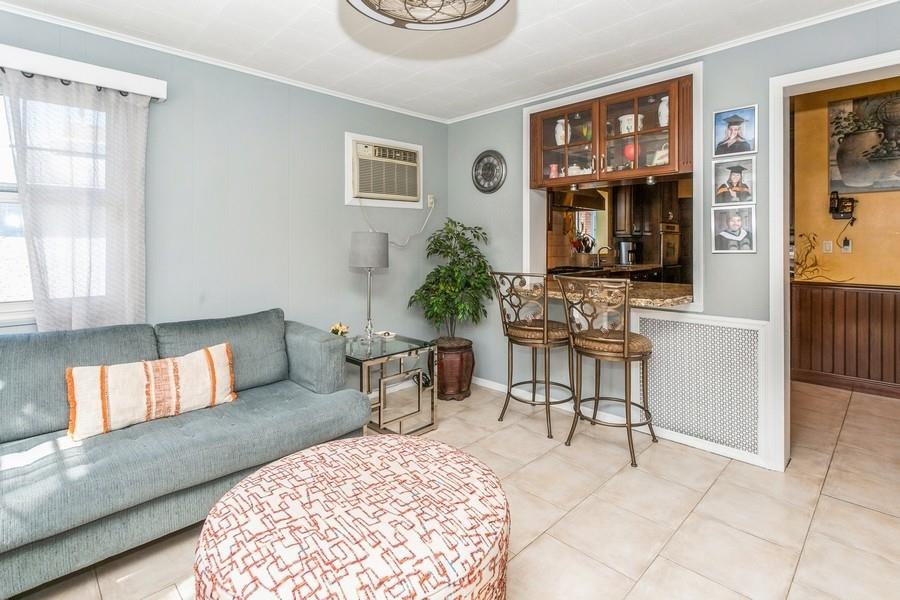 156 80th Street Brooklyn, NY 11209 - Photo 18 of 37 a living room with furniture and window