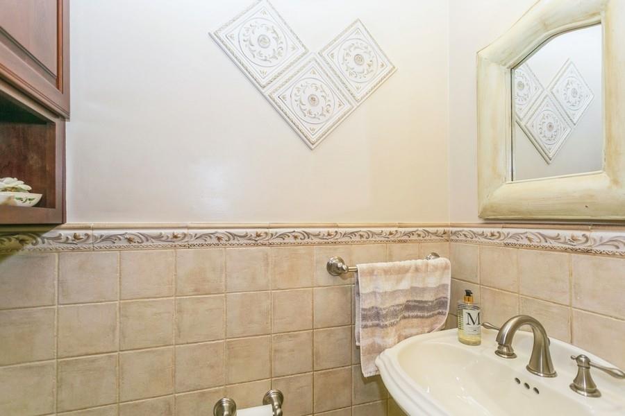 156 80th Street Brooklyn, NY 11209 - Photo 19 of 37 a bathroom with a sink mirror and vanity