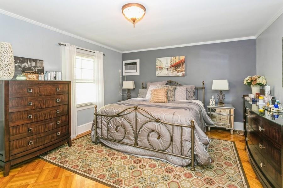 156 80th Street Brooklyn, NY 11209 - Photo 20 of 37 a bedroom with a bed and a dresser in it
