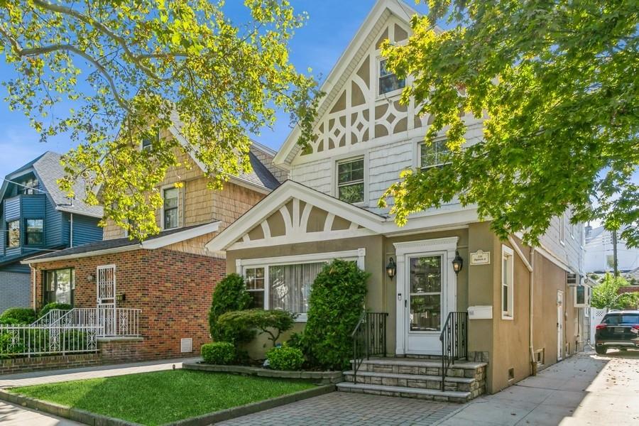 156 80th Street Brooklyn, NY 11209 - Photo 2 of 37 a front view of a house with a garden
