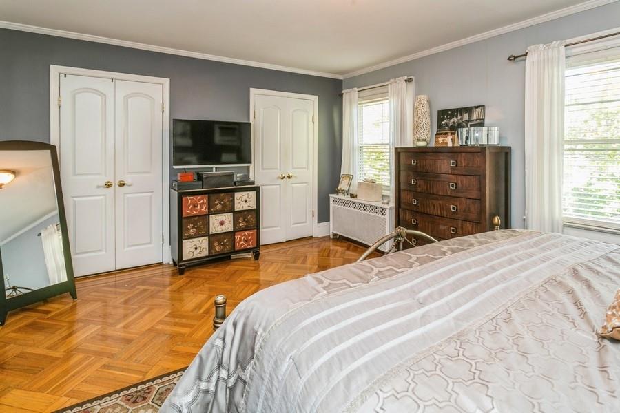 156 80th Street Brooklyn, NY 11209 - Photo 21 of 37 a bedroom with a bed and flat screen tv