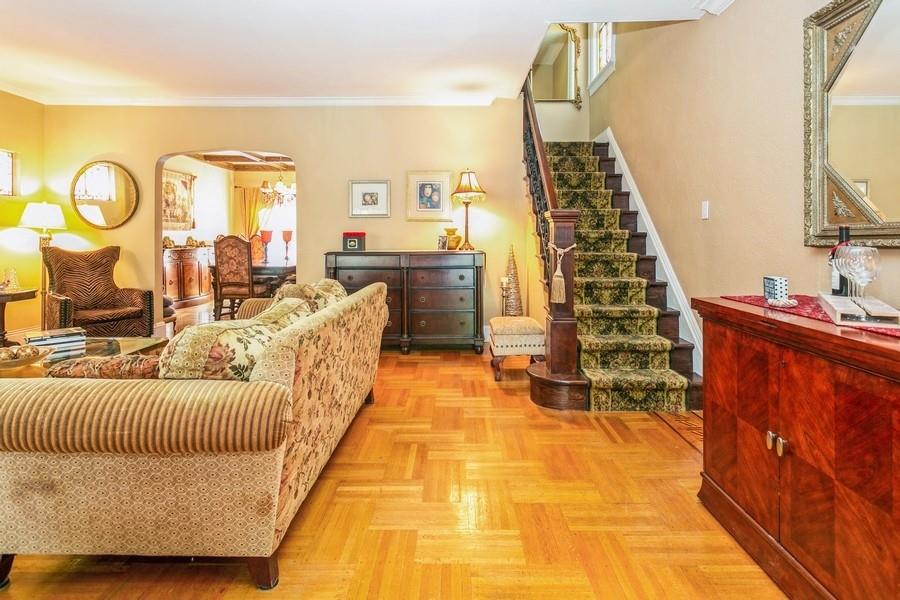 156 80th Street Brooklyn, NY 11209 - Photo 5 of 37 a bedroom with furniture and a chandelier