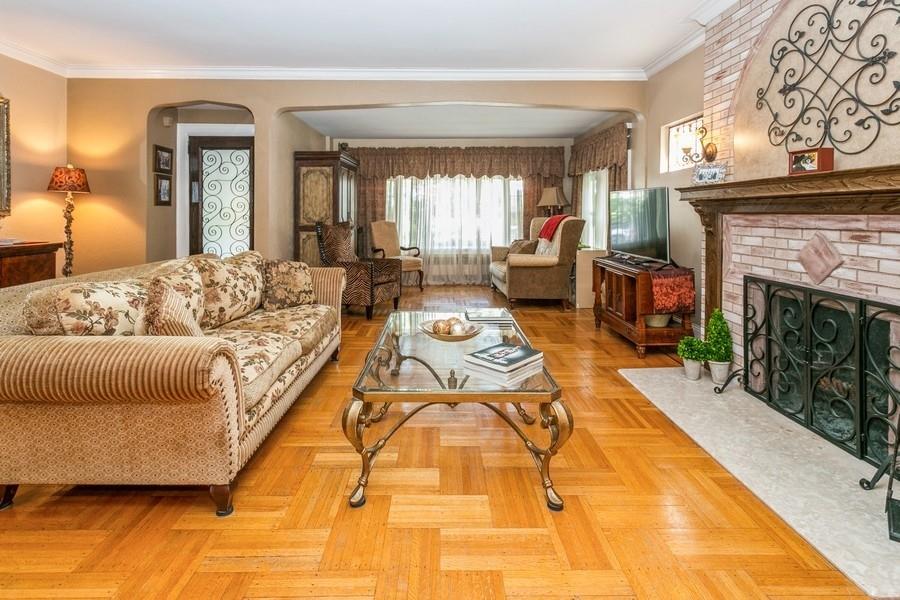156 80th Street Brooklyn, NY 11209 - Photo 7 of 37 a living room with furniture and a fireplace