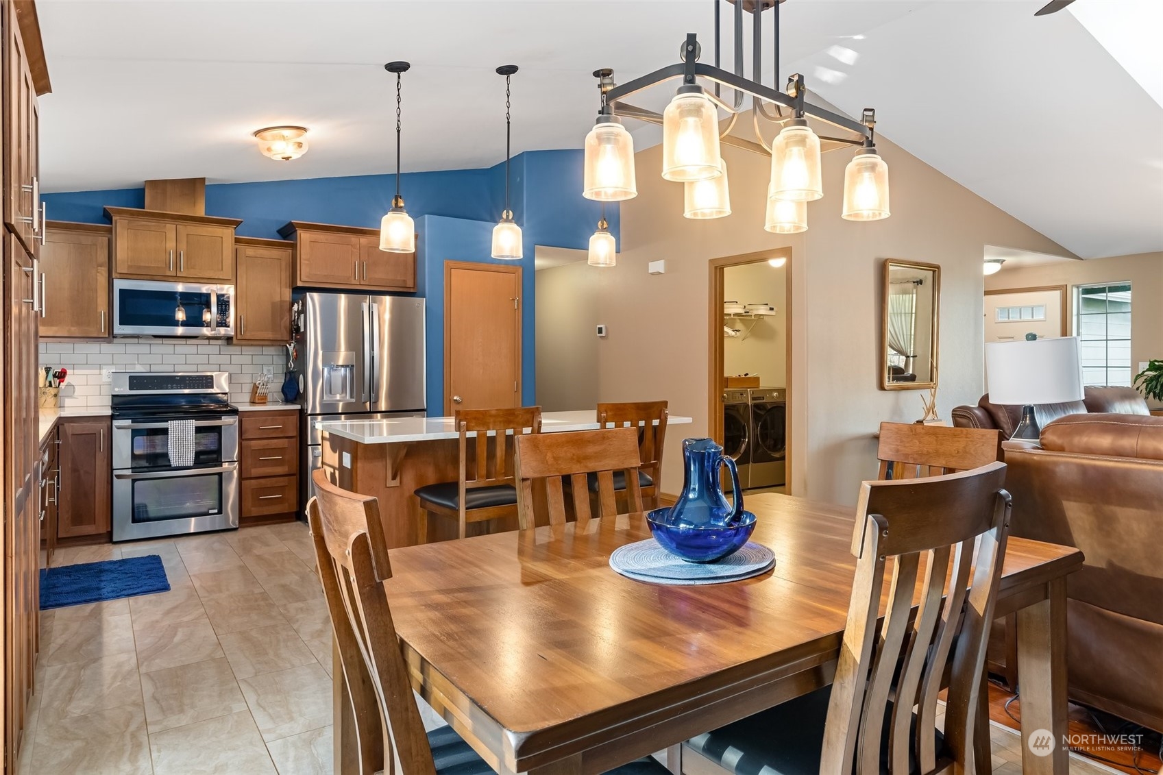 688 Evans Road Toledo, WA 98591 - Photo 14 of 40 a view of a dining room and livingroom with furniture wooden floor a chandelier
