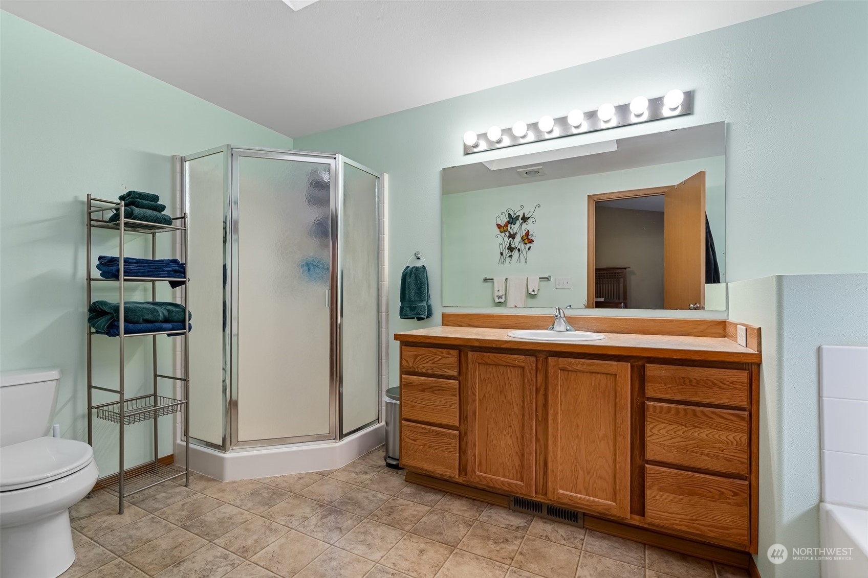 688 Evans Road Toledo, WA 98591 - Photo 19 of 40 a spacious bathroom with a double vanity sink a toilet a mirror and shower