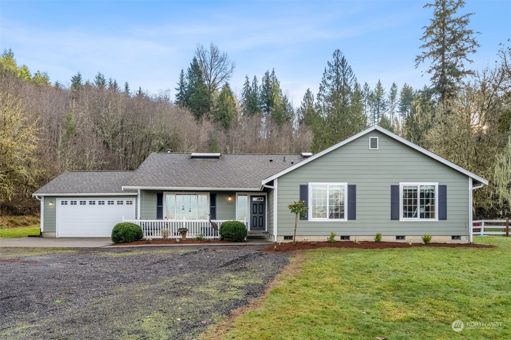 688 Evans Road Toledo, WA 98591 - Photo 2 of 40 a view of a house with a yard and trees