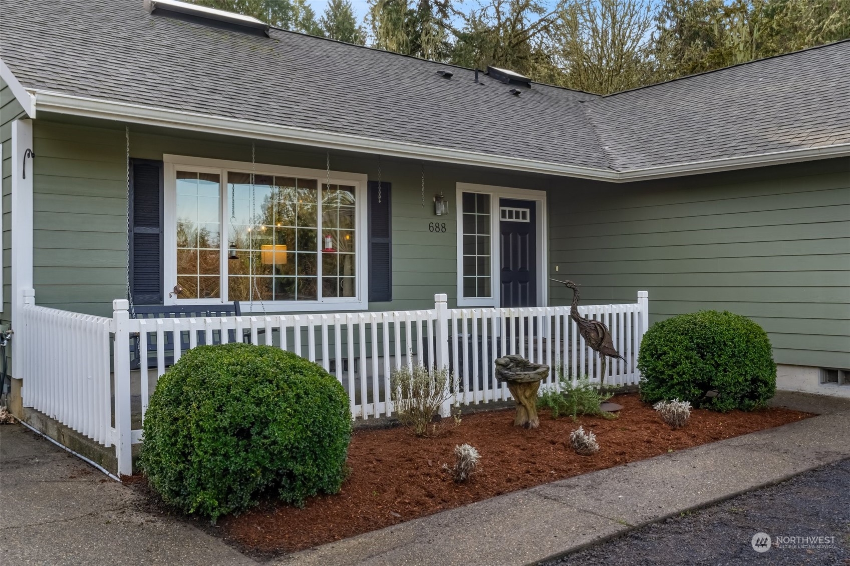 688 Evans Road Toledo, WA 98591 - Photo 4 of 40 a front view of a house with a garden