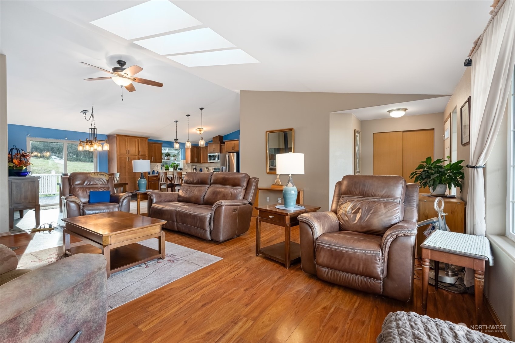 688 Evans Road Toledo, WA 98591 - Photo 6 of 40 a living room with furniture kitchen view and a wooden floor