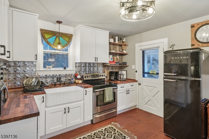 916 East End Road Newton, NJ 07860 - Photo 11 of 31 a kitchen with a sink stove and refrigerator