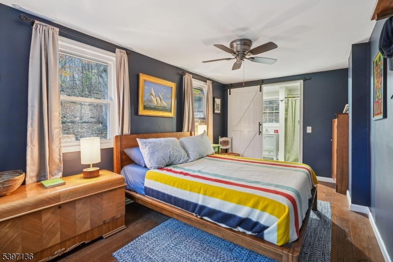 916 East End Road Newton, NJ 07860 - Photo 16 of 31 a bedroom with a bed and a chandelier