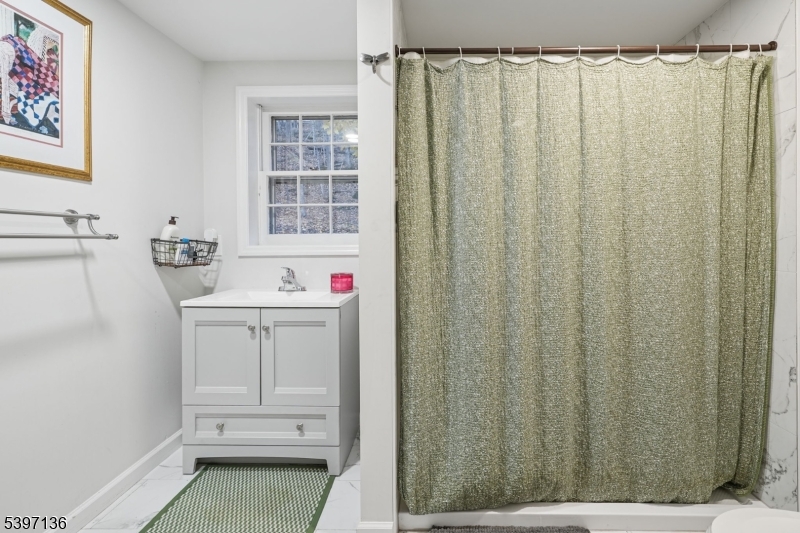 916 East End Road Newton, NJ 07860 - Photo 17 of 31 a bathroom with a sink and a mirror