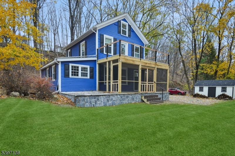 916 East End Road Newton, NJ 07860 - Photo 23 of 31 a house that has a big yard with plants and trees