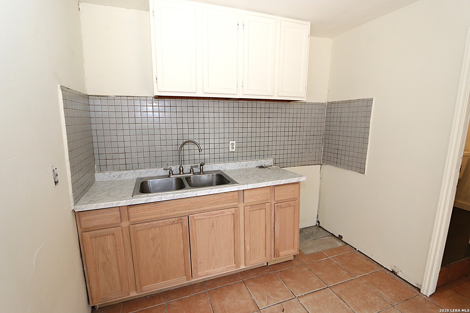 910 Culebra Road San Antonio, TX 78201 - Photo 22 of 33 a bathroom with a sink and a mirror
