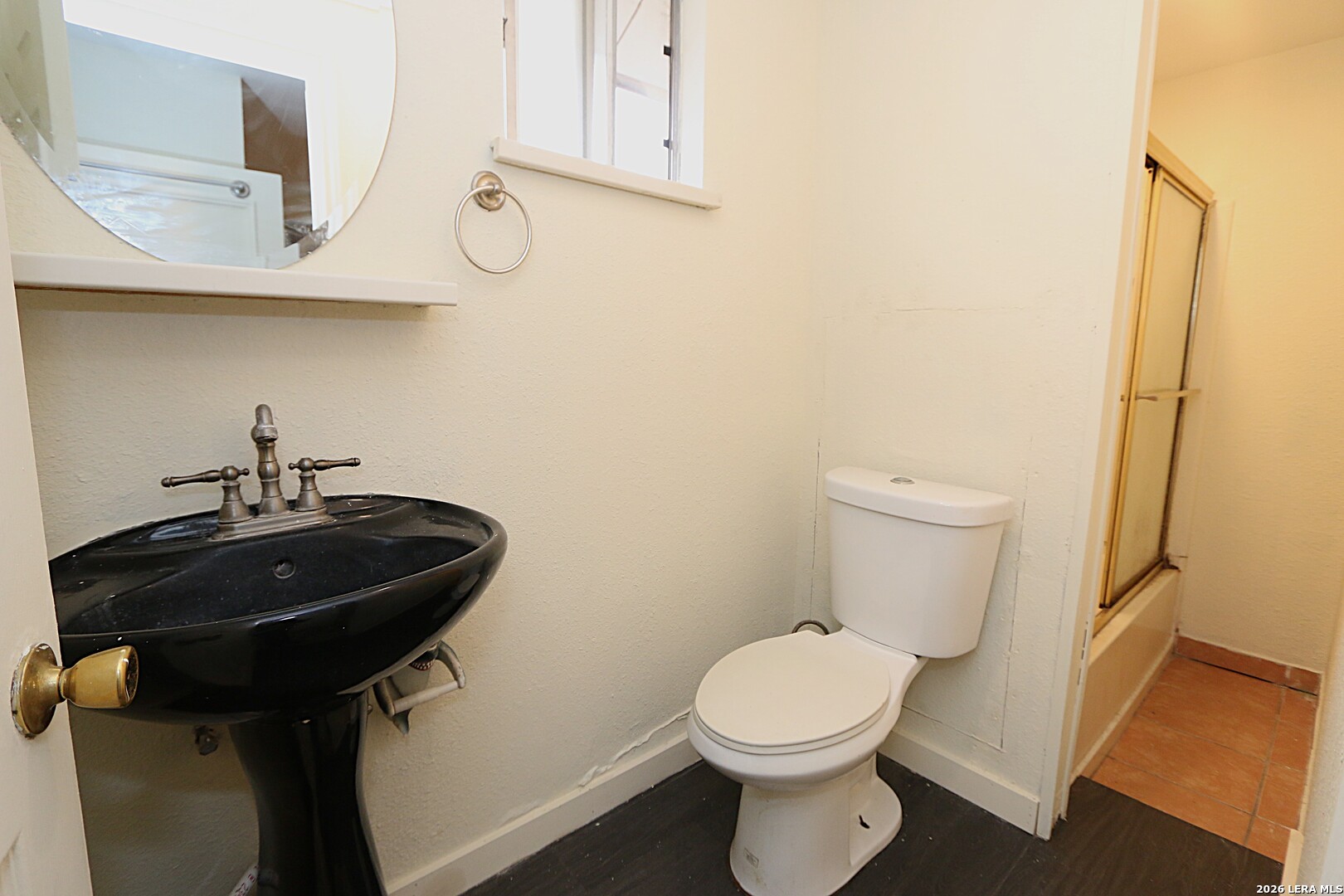 910 Culebra Road San Antonio, TX 78201 - Photo 26 of 33 a bathroom with a toilet and a sink