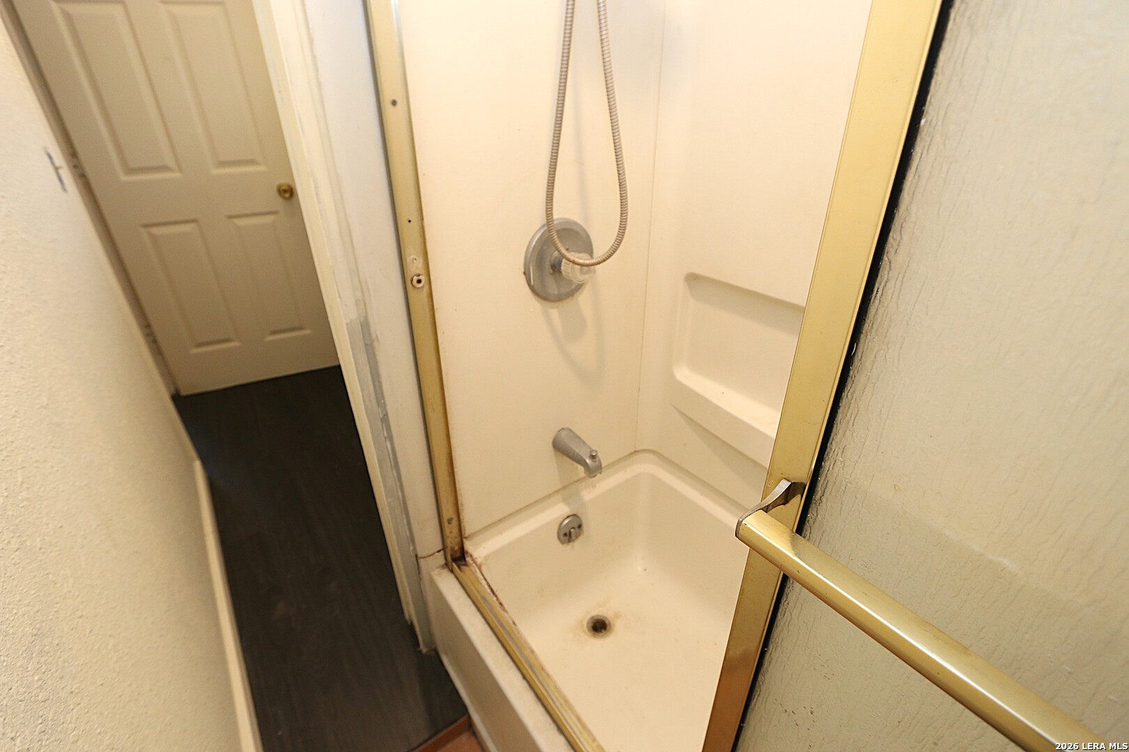 910 Culebra Road San Antonio, TX 78201 - Photo 27 of 33 a bathroom with a tub and a shower