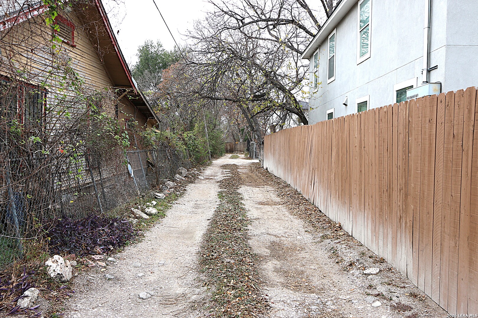 910 Culebra Road San Antonio, TX 78201 - Photo 31 of 33 a view of a pathway with a pathway covered with wooden fence
