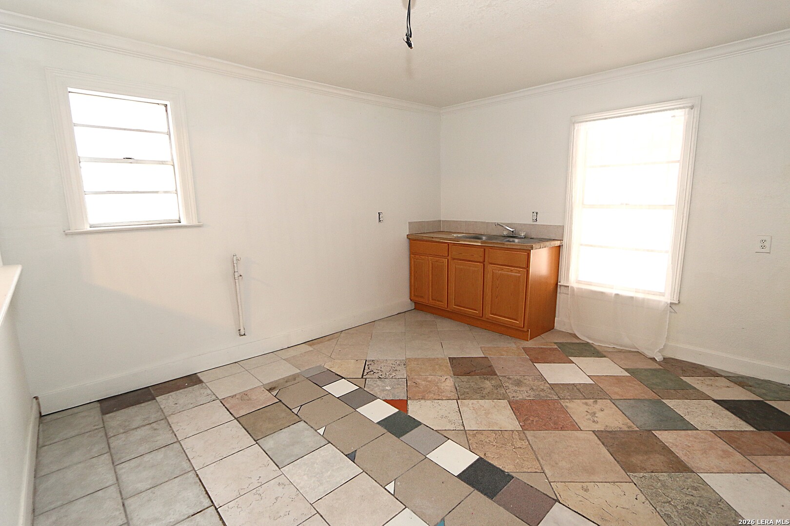 910 Culebra Road San Antonio, TX 78201 - Photo 7 of 33 a room with a black white checkered floor