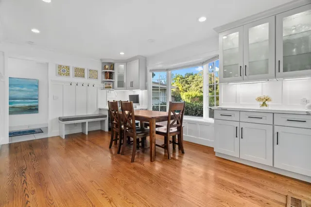 a view of a dining room with furniture window and wooden floor
