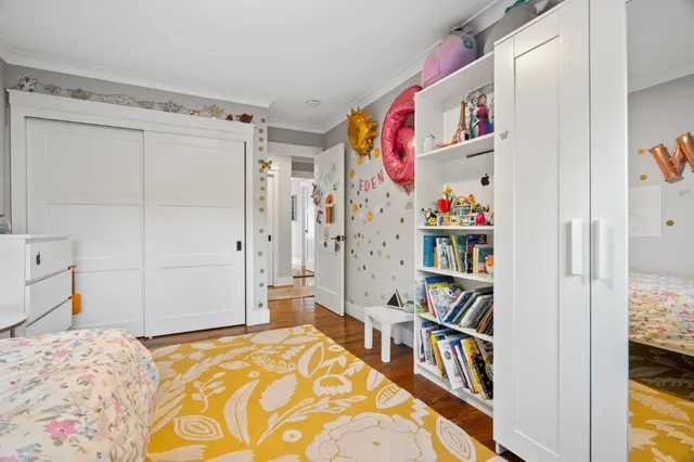 a bedroom with a bed and closet