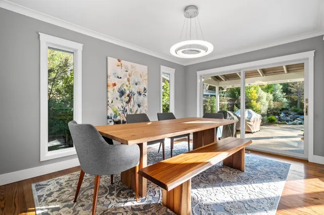 a view of a dining room with furniture window and outside view