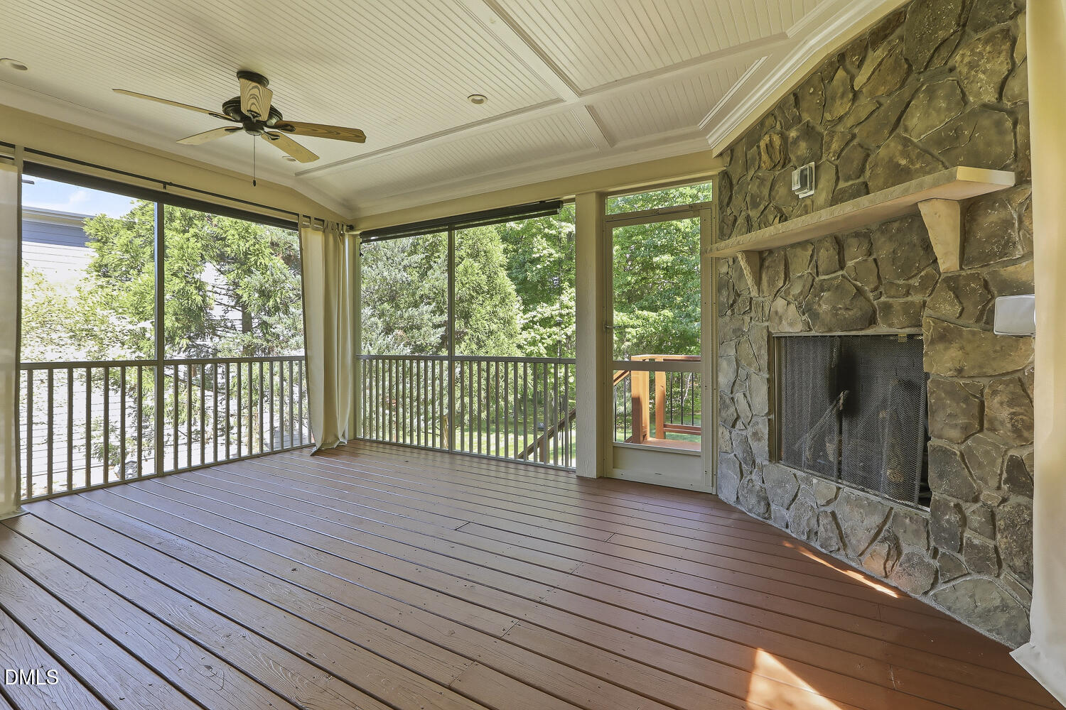 832 Nowell Ridge Road Raleigh, NC 27607 - Photo 39 of 76 Screen Porch with Gas Fireplace Overlooking Private Backyard.