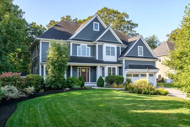 a front view of a house with a yard
