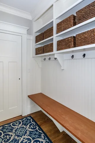 a room with wooden floor and cabinets