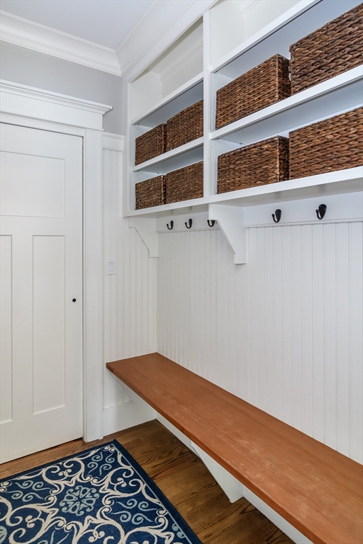 15 Hunters Lane Natick, MA 01760 - Photo 14 of 42 a room with wooden floor and cabinets