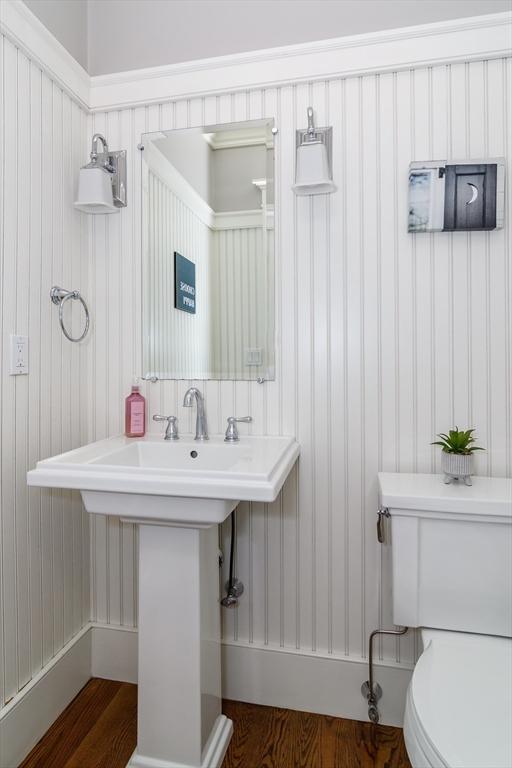 15 Hunters Lane Natick, MA 01760 - Photo 15 of 42 a bathroom with a sink a toilet and shower curtain