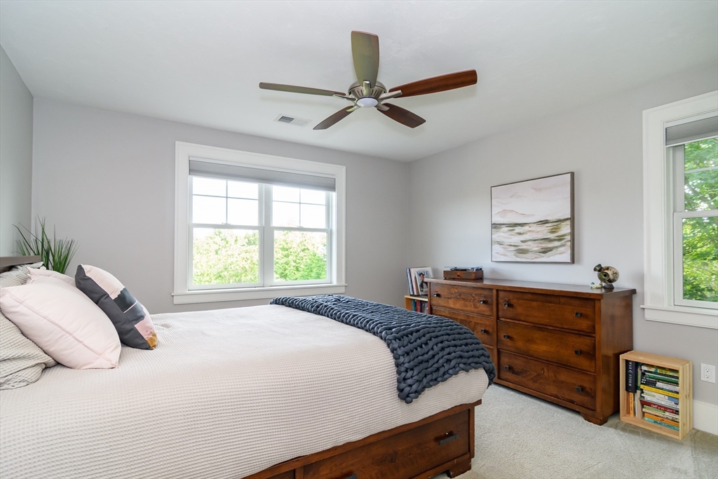 15 Hunters Lane Natick, MA 01760 - Photo 19 of 42 a bedroom with a bed and a window