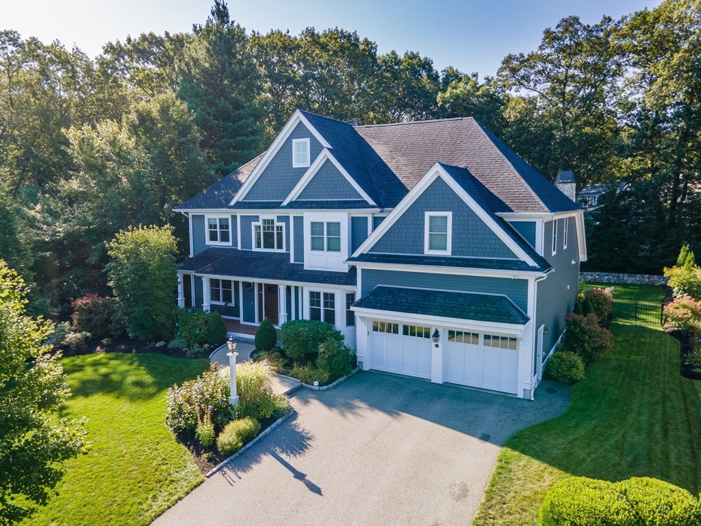 15 Hunters Lane Natick, MA 01760 - Photo 2 of 42 a front view of a house with garden