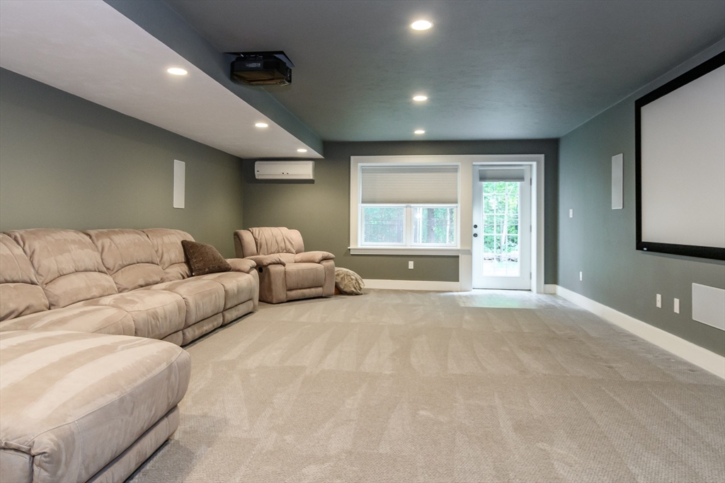 15 Hunters Lane Natick, MA 01760 - Photo 26 of 42 a living room with furniture a large window and a couch