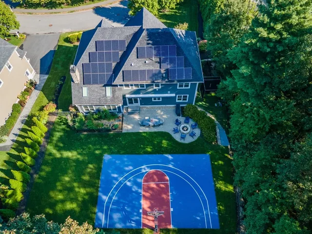 a aerial view of a house with a yard