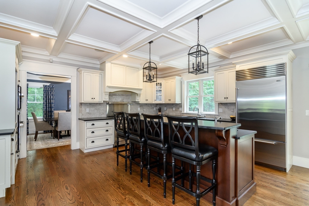 15 Hunters Lane Natick, MA 01760 - Photo 6 of 42 a kitchen with a table and chairs in it