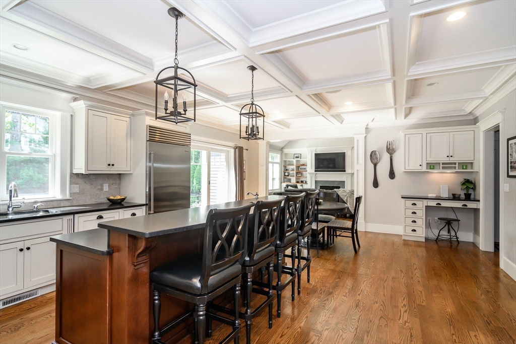 15 Hunters Lane Natick, MA 01760 - Photo 7 of 42 a view of a dining room with furniture and wooden floor