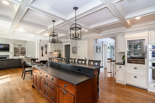 a kitchen with stainless steel appliances granite countertop a sink and a stove