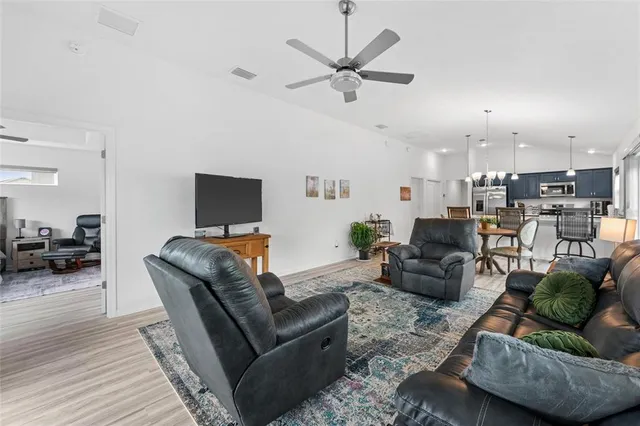 a kitchen with stainless steel appliances granite countertop a stove a microwave and cabinets