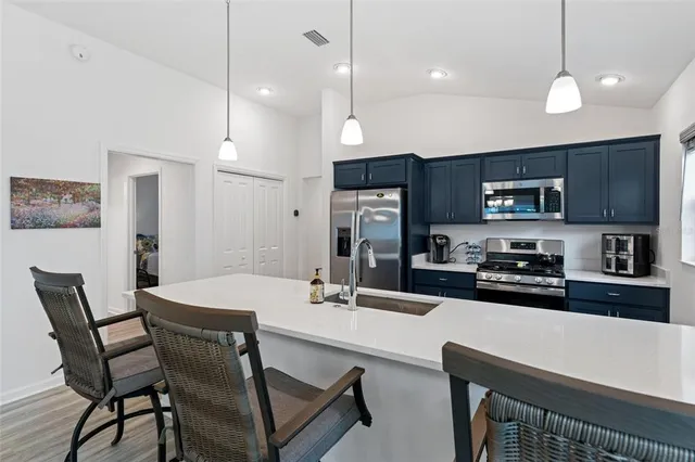 a bedroom with a bed and a chair