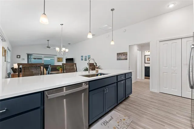 a en suite bathroom with a double vanity sink and a mirror