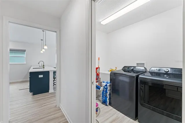 a front view of a house with a yard outdoor seating and mountain view