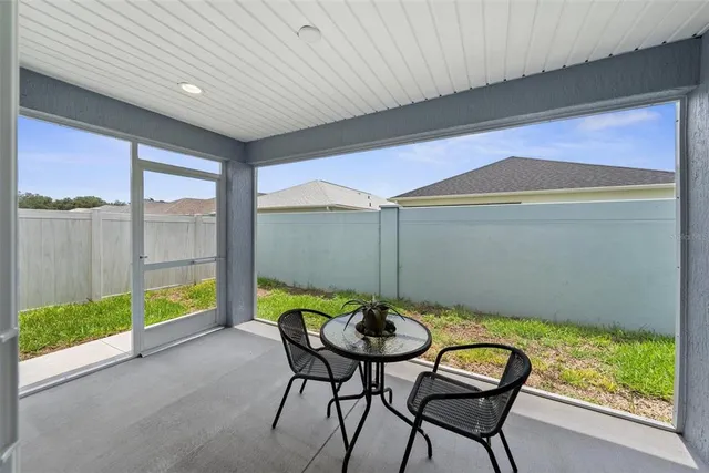 an aerial view of a house with a swimming pool
