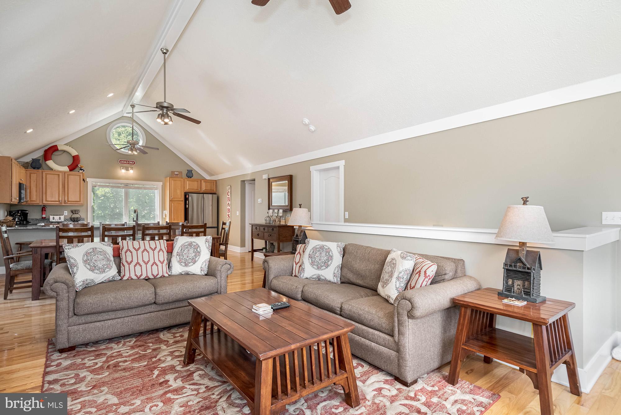 25 Silver Tree Lane Oakland, MD 21550 - Photo 26 of 52 a living room with furniture and a chandelier