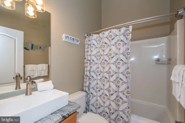 a bedroom with a bed and a television