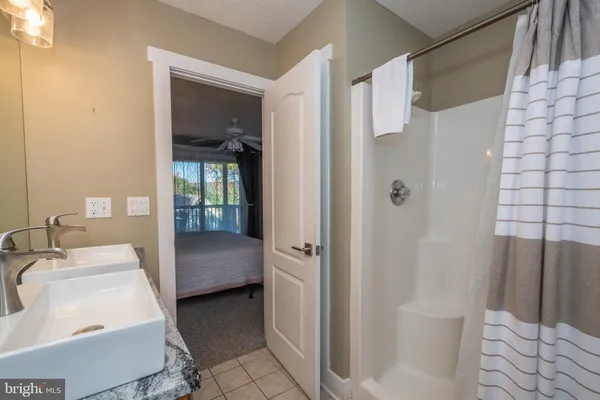 a bathroom with a sink mirror vanity and toilet