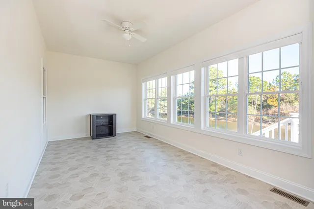 a view of livingroom with furniture wooden floor and windows
