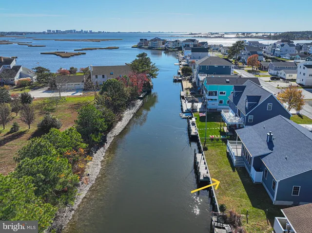 an aerial view of a house with outdoor space