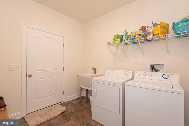 a living room with furniture and a ceiling fan