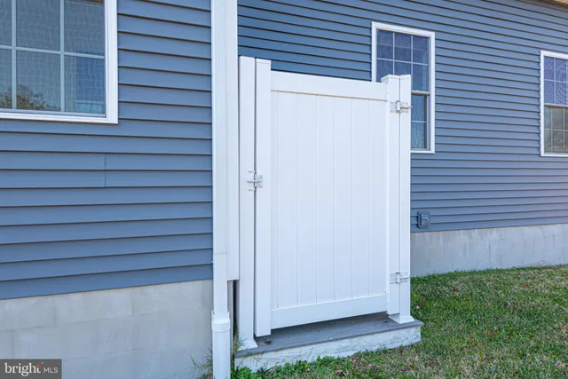 a balcony with wooden floor and fence